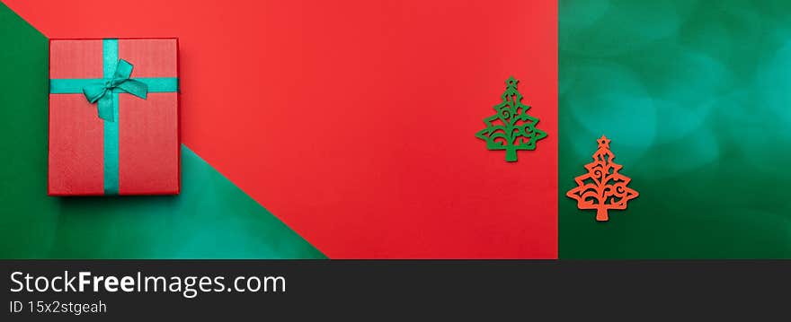 Festive background with Christmas tree and gift box