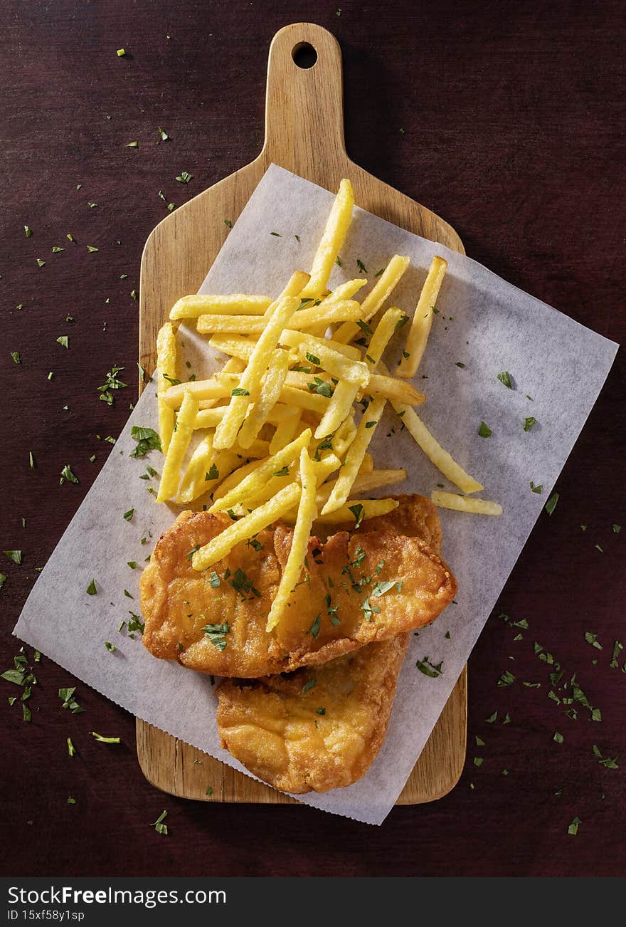 flat lay fish chips chopping board. High quality photo