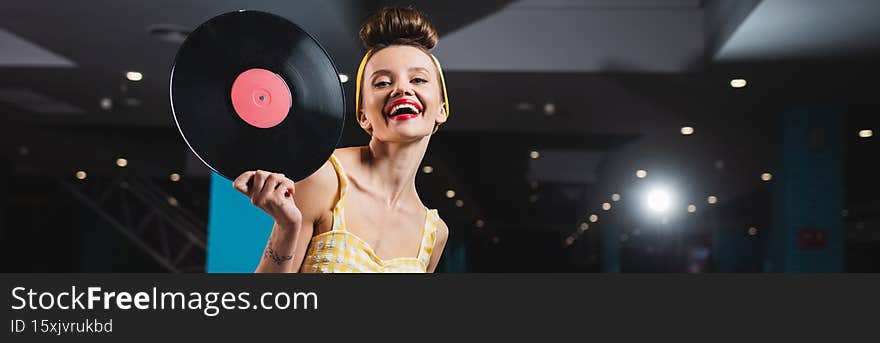 happy pin up woman with red lips holding retro vinyl disc, banner,stock image
