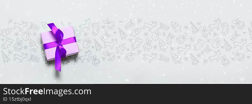 Merry Christmas and Happy New Year banner with handmade gift box trendy festive decorations with copyspace on blue