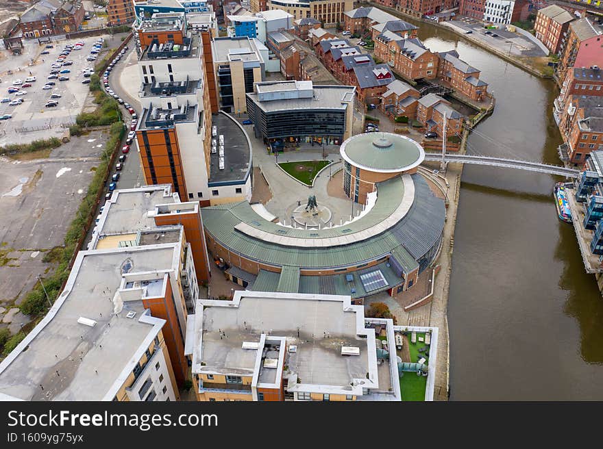 Aerial photo of the area in the Leeds City Centre known as Brewery Wharf on a beautiful sunny summers day showing buildings by the