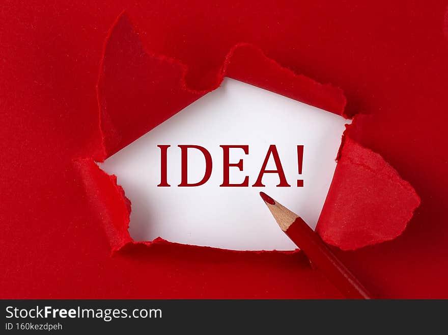 IDEA text on the red torn paper with red pencil