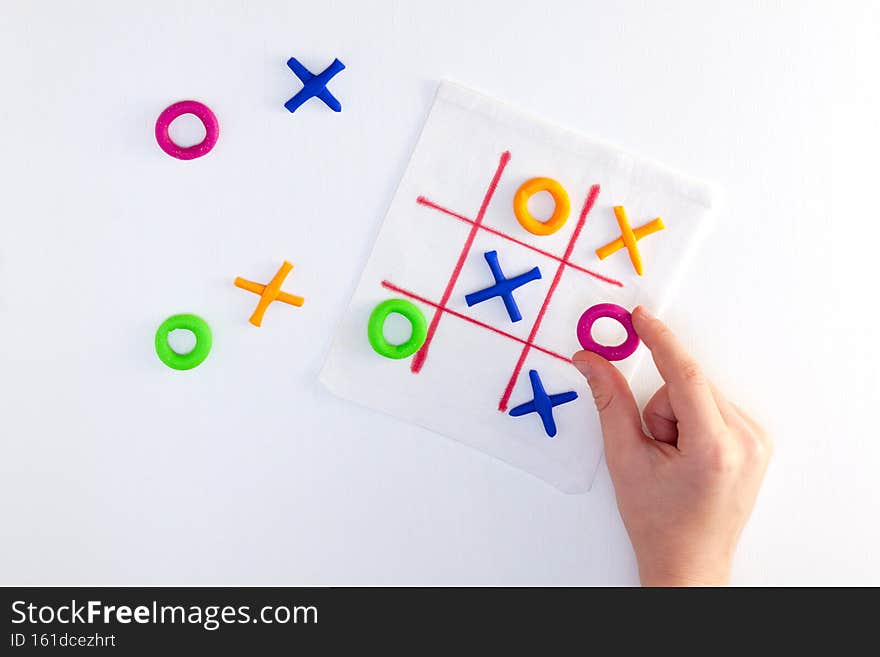 Tic tac toe game from colorful plasticine. DIY concept, simple handmade game.