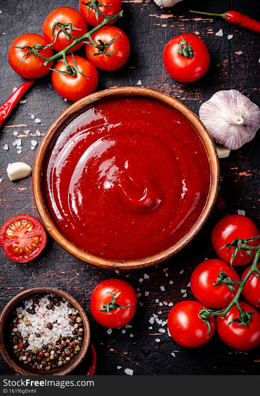 Tomato sauce with garlic and spices. Against a dark background. High quality photo