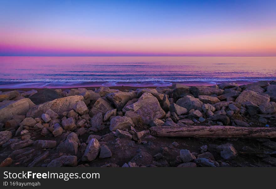 Purple Water Amongst The Rocks