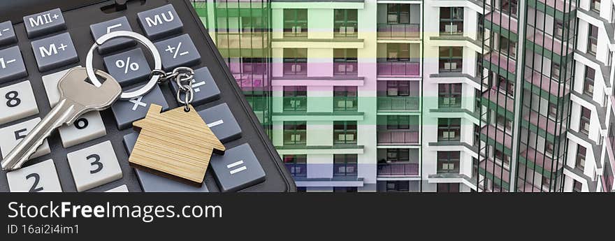 The concept of mortgage, sale and rental of housing. Mortgage credit lending. Calculator with keys and a keychain in the form of a