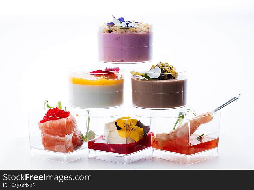 Sweet snacks in clear glasses for events. Catering. Copy space.