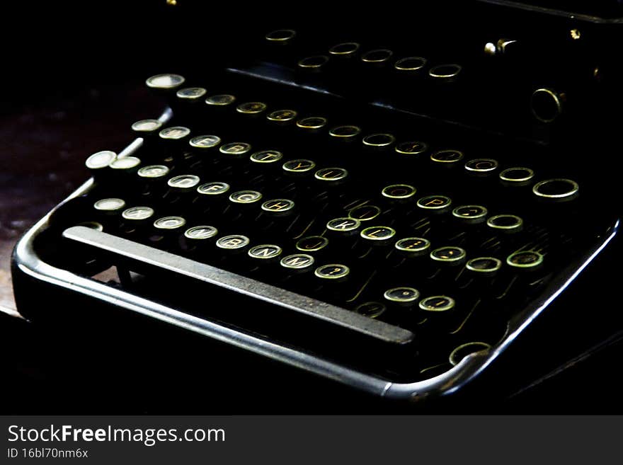 Old typewriter with worn keys and gloomy atmosphere. Writing concept. Typewriter concept.
