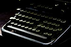 Old Typewriter With Worn Keys And Gloomy Atmosphere. Stock Photo