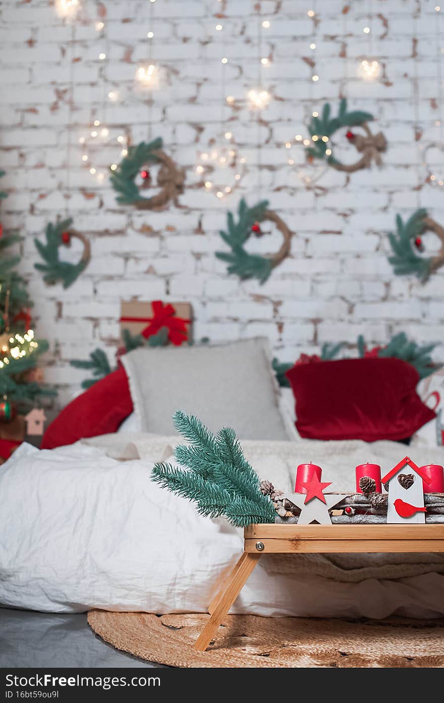 Bedroom is decorated for New Year. Interior details with Christmas decor..