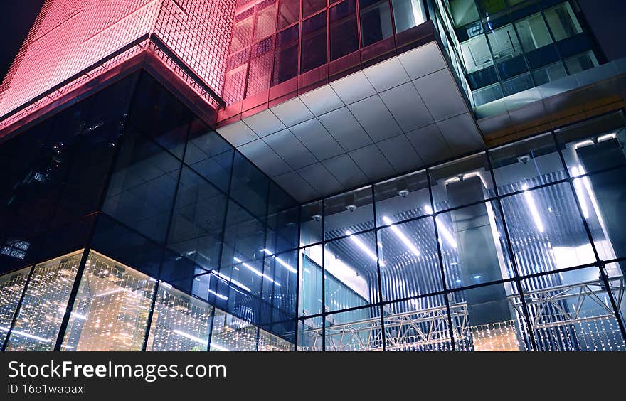 View with illuminated modern skyscraper. Scenic glowing windows of skyscrapers at evening. View with illuminated modern skyscraper. Scenic glowing windows of skyscrapers at evening.