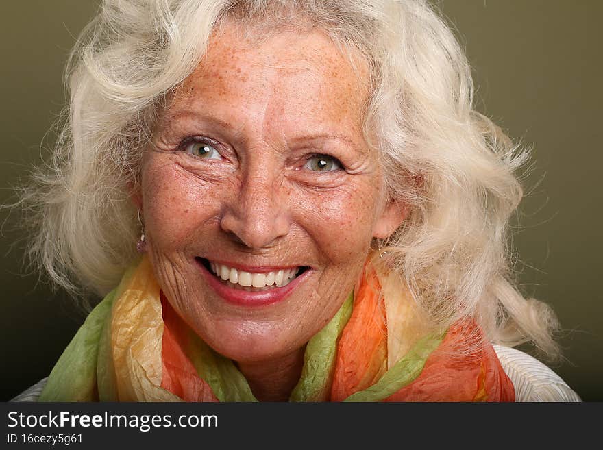 Portrait of a beautiful happy woman in front of a colored background. High quality photo