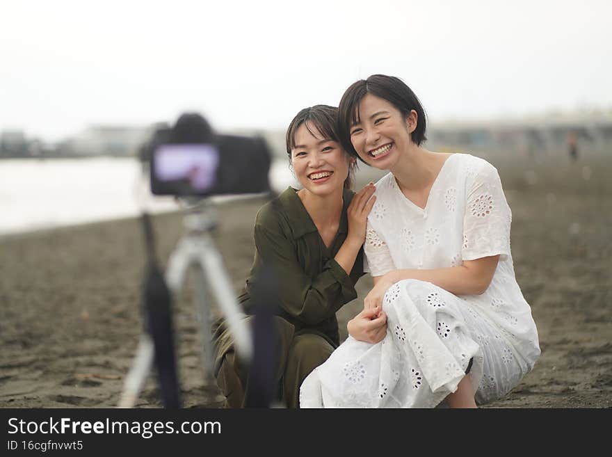 Image of a women taking a picture with the self-timer. Image of a women taking a picture with the self-timer
