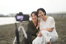Female Taking A Photo With The Self-timer Royalty Free Stock Image