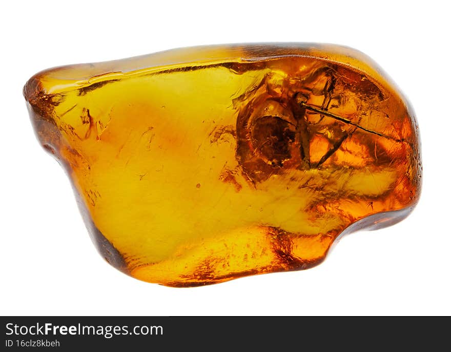 Spider inclusion in yellow transparent natural amber. Macro photography. Spider inclusion in yellow transparent natural amber. Macro photography.