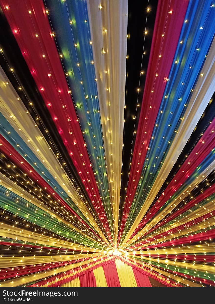 Decorated ceiling with led lights and colourful cloths