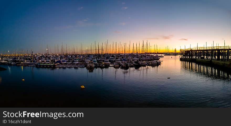 Sea marina for yachts in the evening, the sun sets