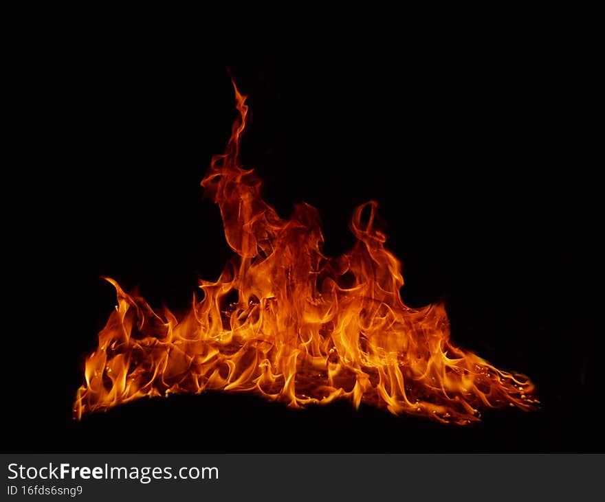 Flame Flame Texture For Strange Shape Fire Background Flame meat that is burned from the stove or from cooking. danger feeling abstract black background Suitable for banners or advertisements