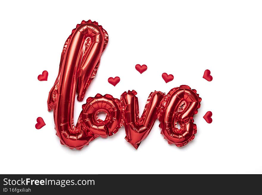 Inflatable letters love in red color isolated on white background Flat lay Top view Holiday card, Happy Valentines day concept Love in air