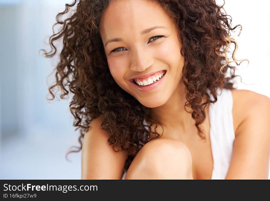 She& x27;s got a bubbly personality. Naturally gorgeous young woman looking at you with a smile.