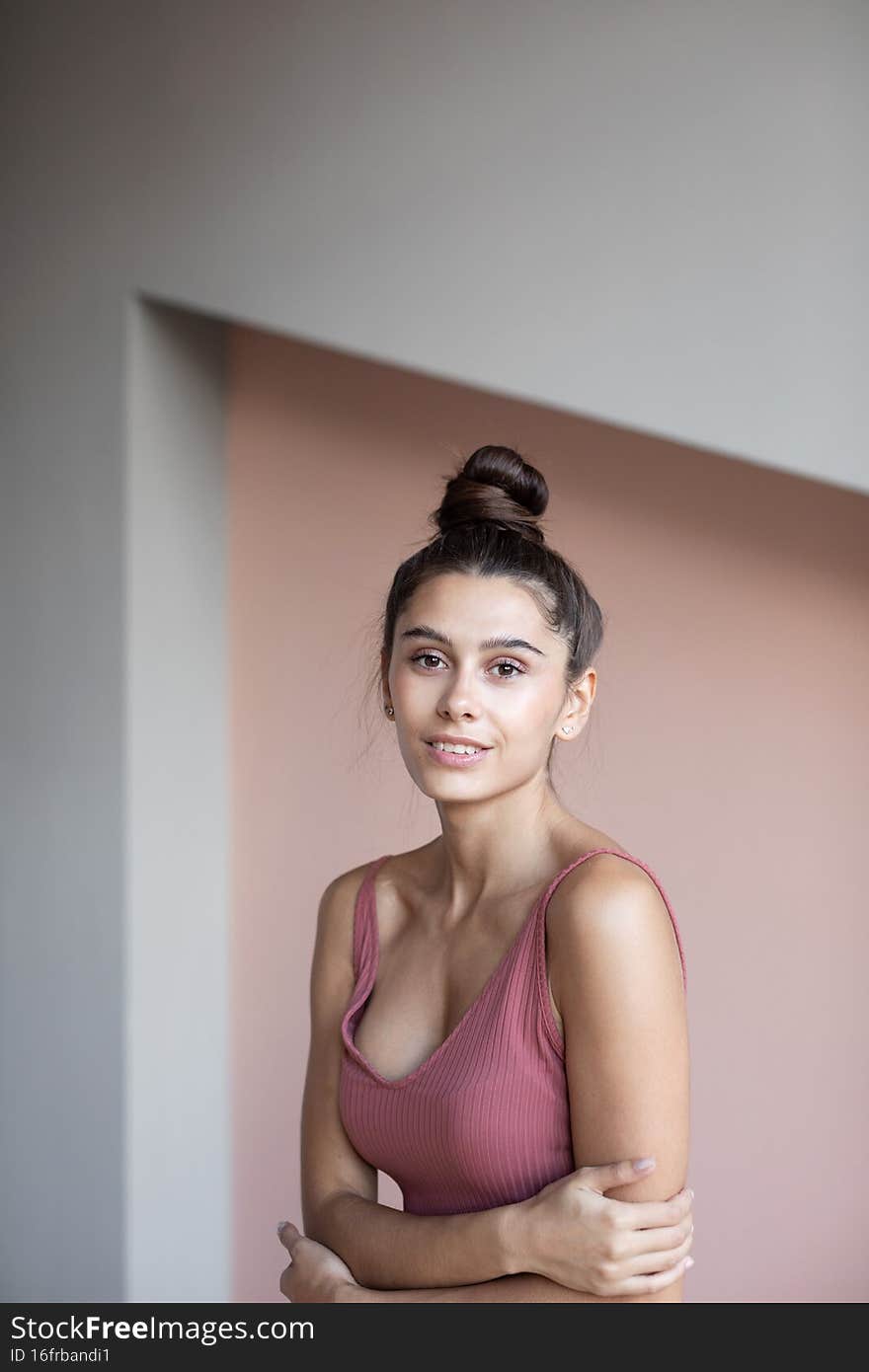 Portrait of a cute smiling woman indoors. Girl with an open smile