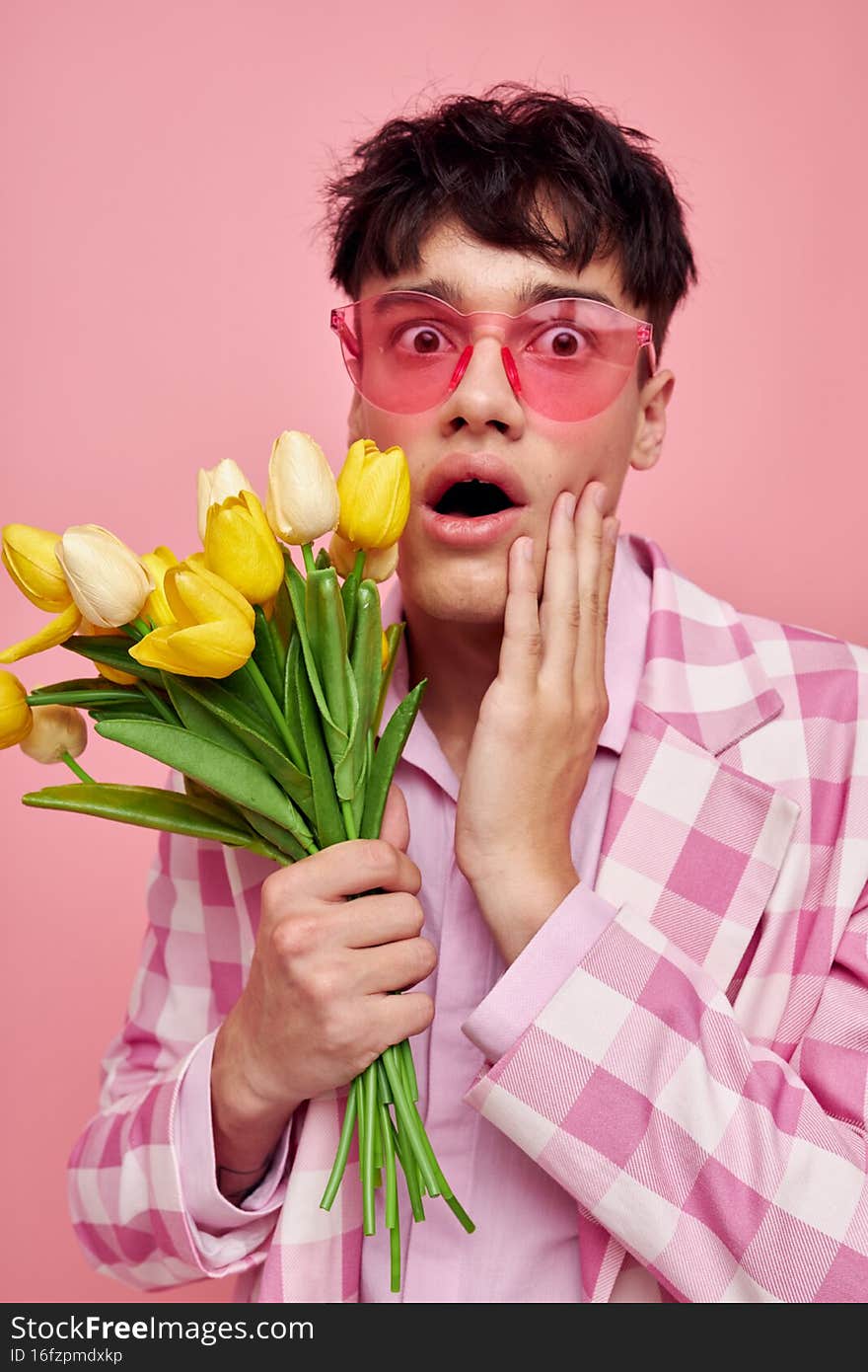 A young man pink plaid blazer fashion modern style isolated background unaltered. High quality photo