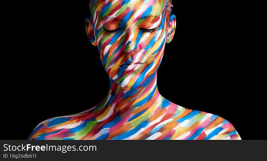 In living colour. Cropped shot of a young woman posing with paint on her face.
