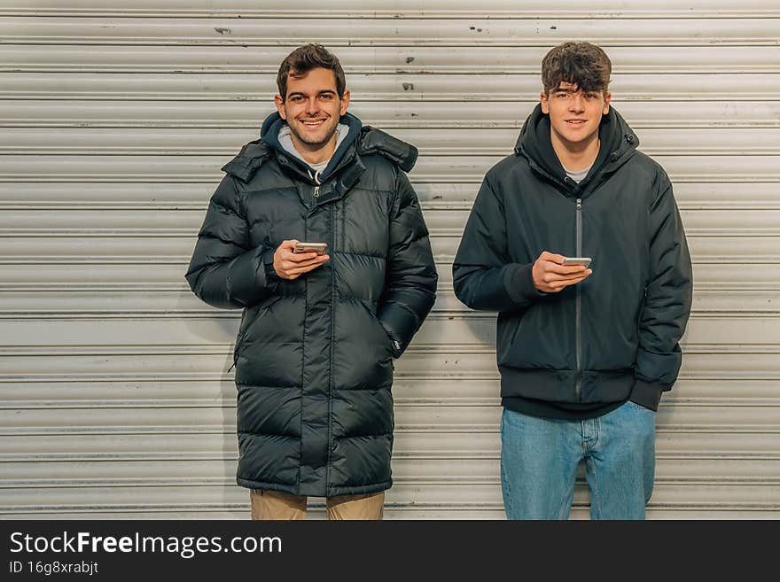 Young people on the street with mobile phone