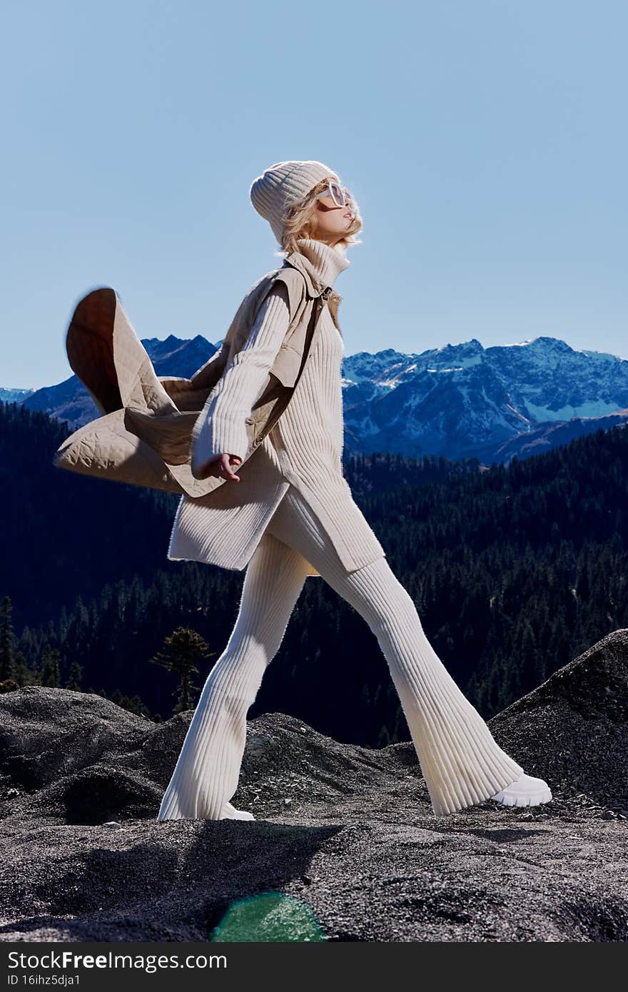 woman standing on the top of the mountain forest lifestyle. High quality photo