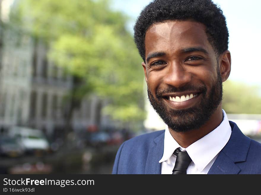 Portrait of a beautiful business man outside. High quality photo