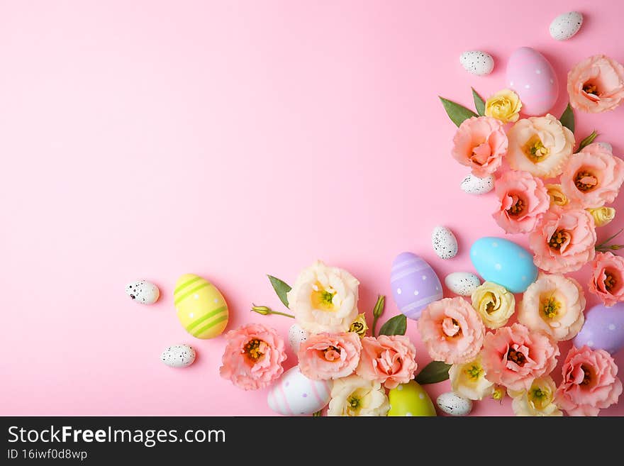 Flowers and Easter eggs on a colored background close-up. Easter background