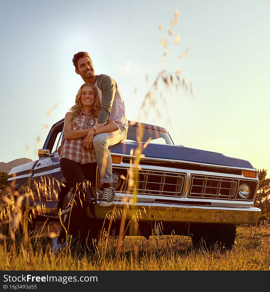 Shot of an affectionate young couple enjoying a roadtrip together. Shot of an affectionate young couple enjoying a roadtrip together
