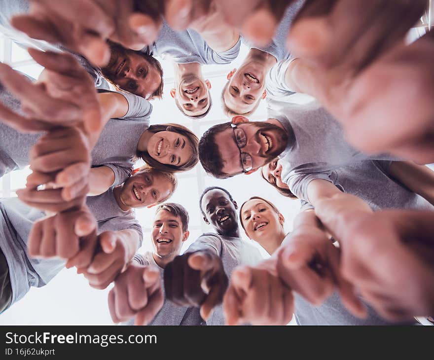 bottom view. group of successful young people looking at the camera . the concept of team building
