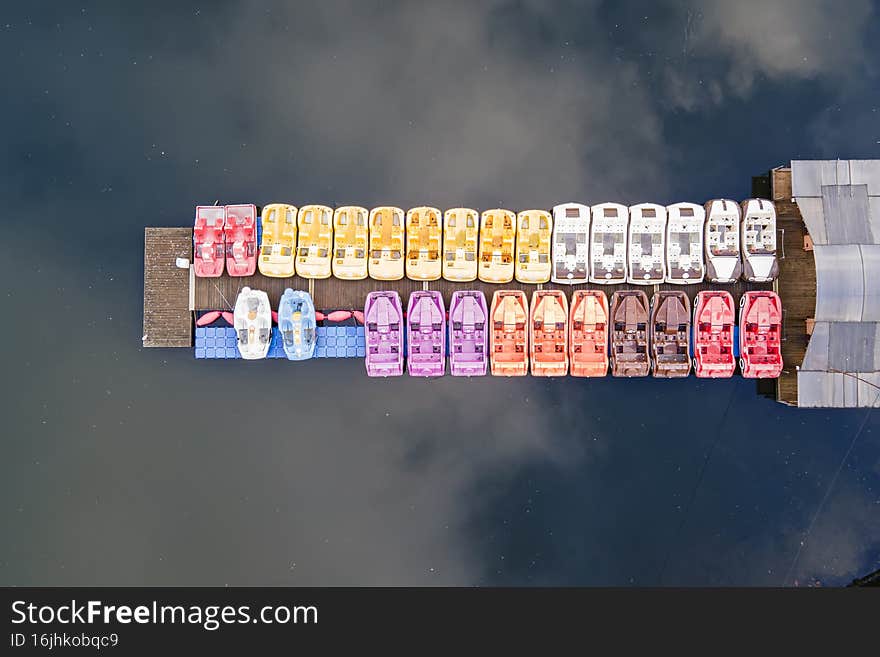 Aerial drone view. Catamaran in a pond in park