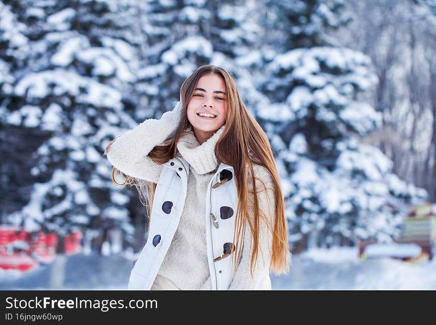 Portrait of a young beautiful brunette woman in white sweater. Portrait of a young beautiful brunette woman in white sweater