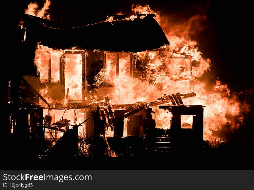 impressive image of a building reduced to ashes by the flames. impressive image of a building reduced to ashes by the flames