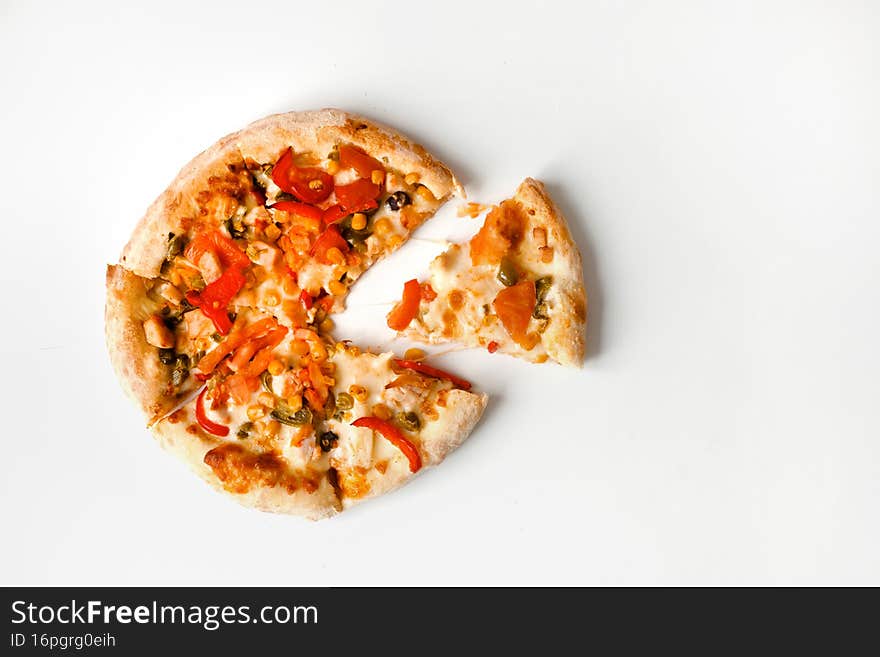 Small mexican pizza in cardboard box for delivery or take away isolated on white. Top view