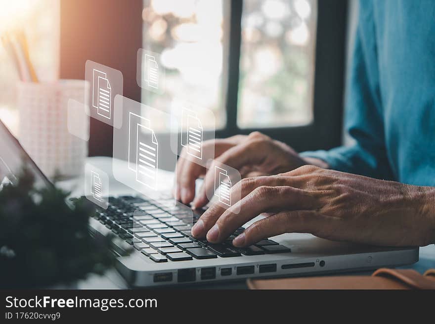 Businessman hand using laptop computer with document management icon, Document management data system business internet technology concept