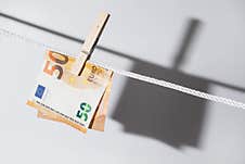 Euro Banknote Is Hung On A Rope With Clothespin Stock Photos