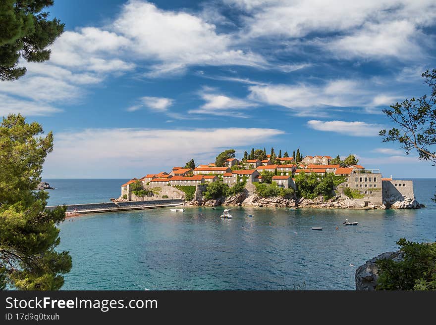 Sveti Stefan island in Budva at summer day, Montenegro. Sveti Stefan luxury touristic resort with historical village on the island in Adriatic sea, Budva, Montenegro. Summer holiday destination. Sveti Stefan island in Budva at summer day, Montenegro. Sveti Stefan luxury touristic resort with historical village on the island in Adriatic sea, Budva, Montenegro. Summer holiday destination