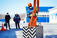 Working Slinger Passes Exam On Lifting Loads. Real Scene. Commission Evaluates Skill Of Slinger. Stock Photo