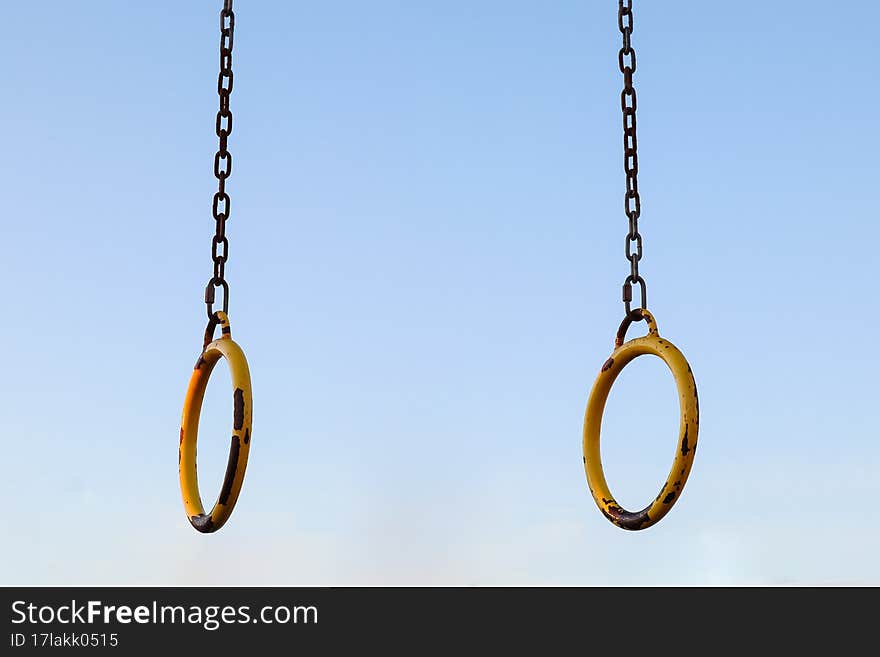 iron sports rings horizontal bar on the sky background