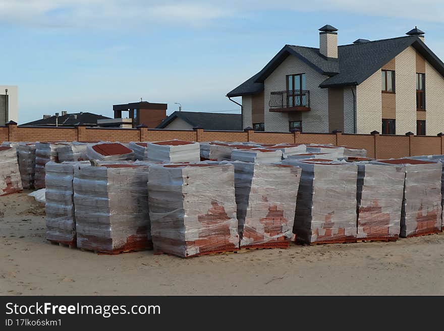 a lot of pallets of bricks for construction in film