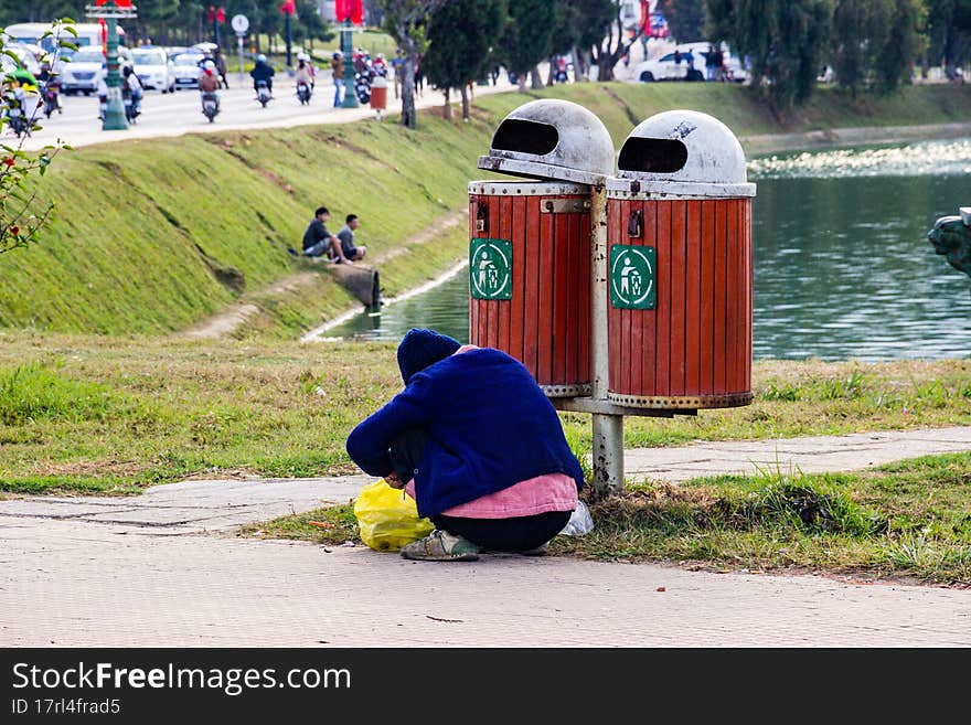 old man collects bottles in the city