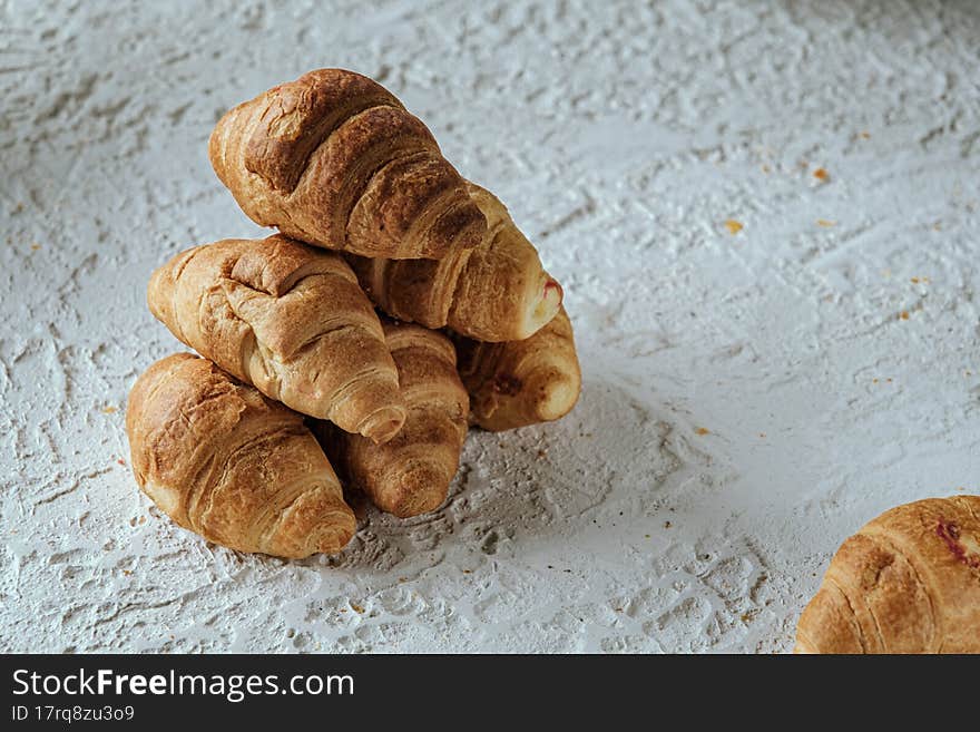 croissants with chocolate on a light background