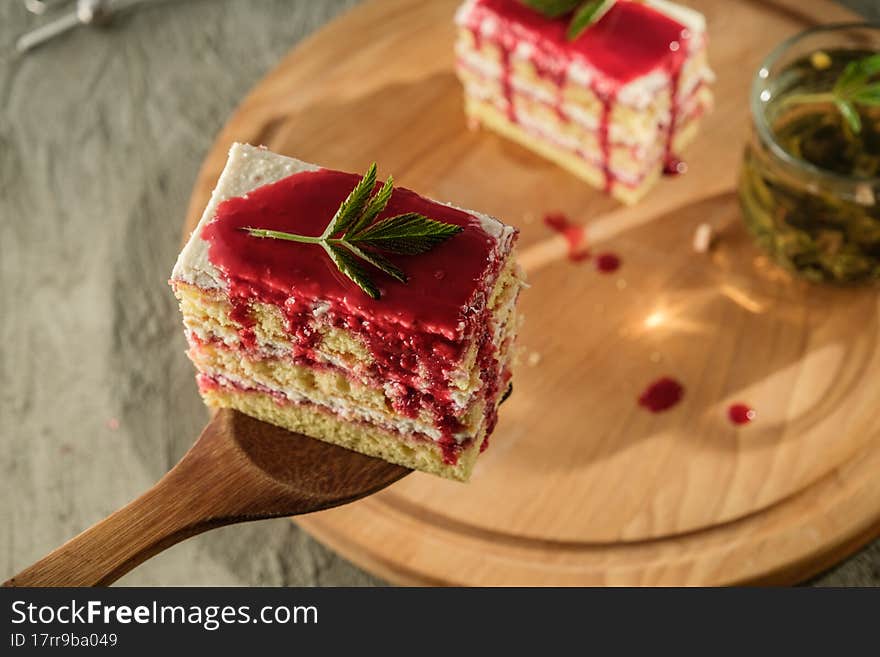 Delicious dessert biscuit with raspberries and green fragrant tea, home decor, gray background