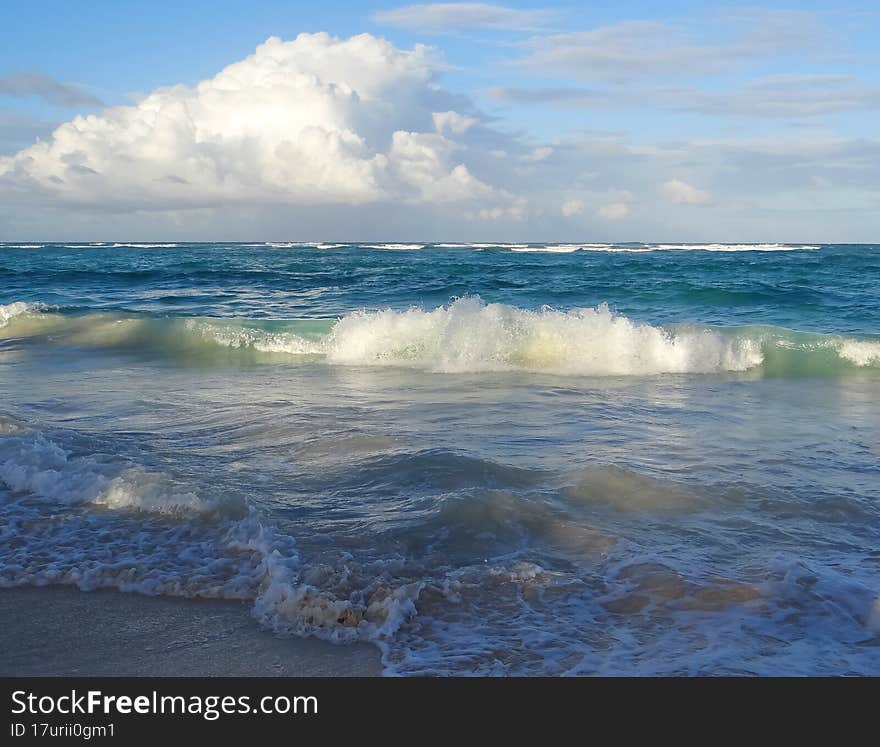 Waves white clouds ocean shore