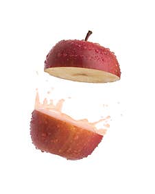 Apple With Juice Splash On White Background Royalty Free Stock Images