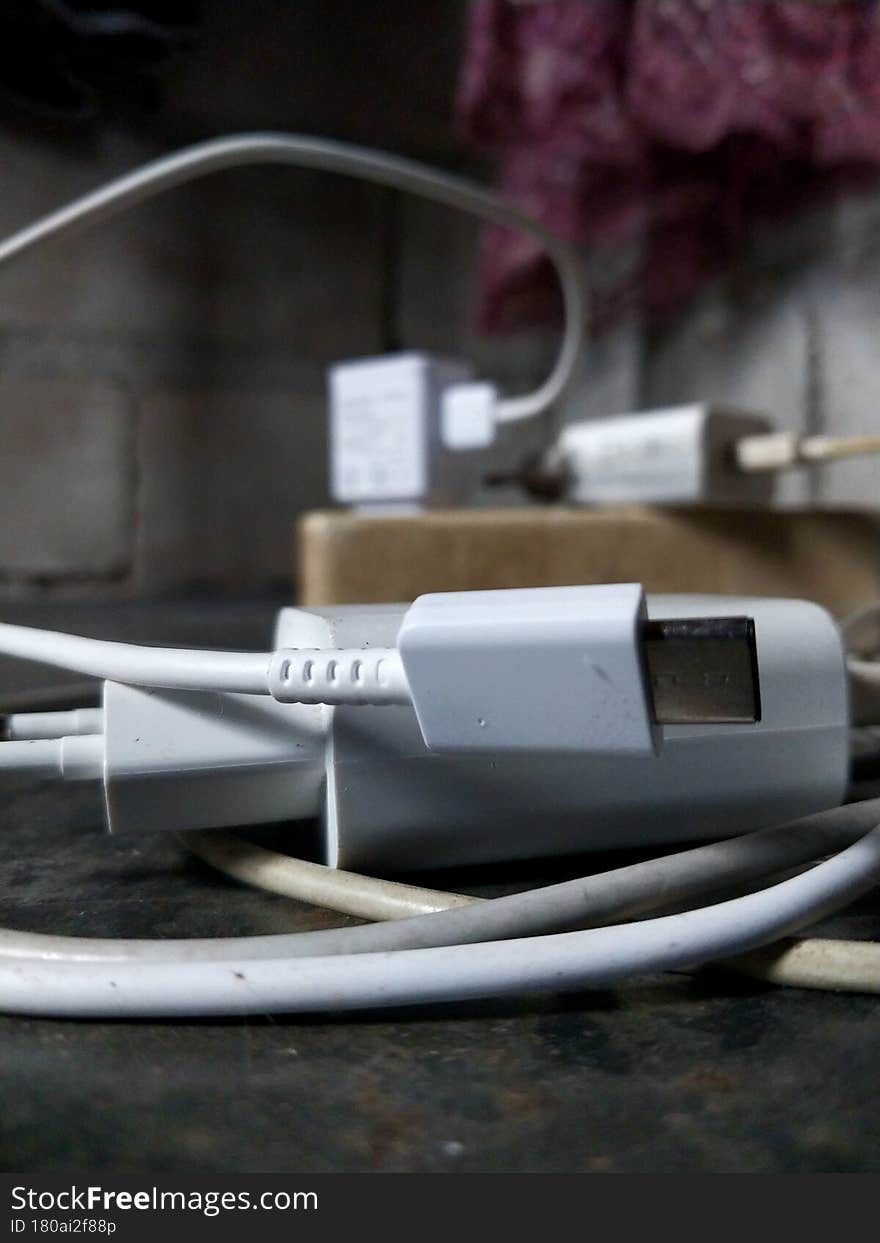 A mobile charger piles up above the electric terminal when it was not used. A mobile charger piles up above the electric terminal when it was not used