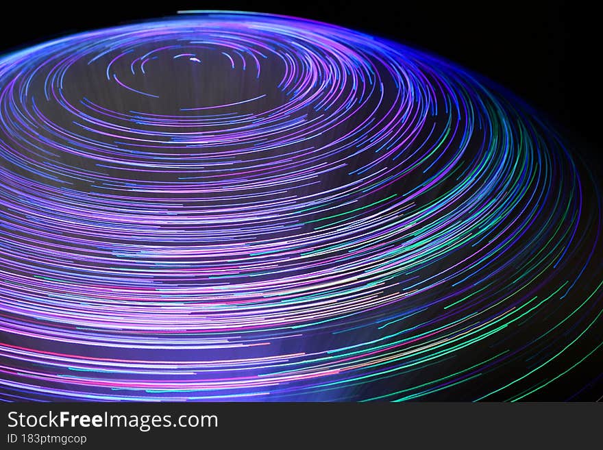 Abstract background. Colored vortex effect created with fiber optic light source.